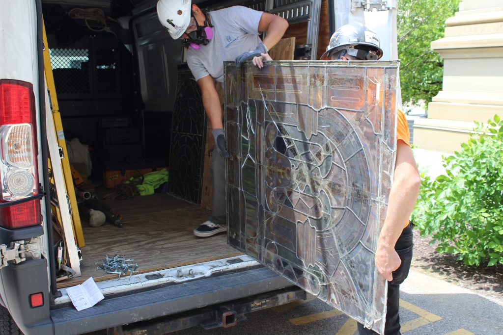 Loading the stained glass on to the van.